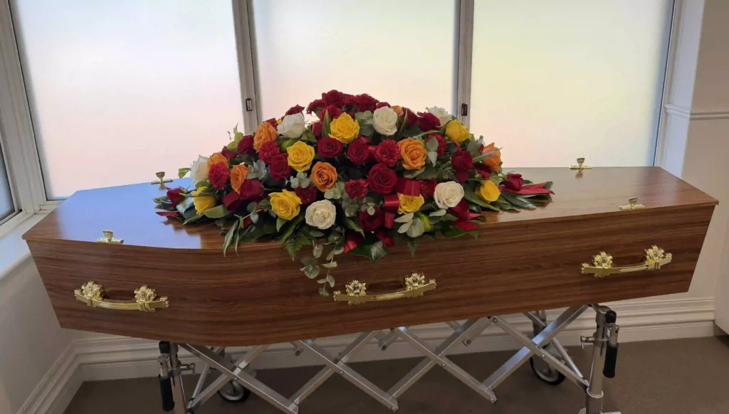 Balla Coffin with Rose Casket Spray