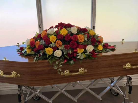 Balla Coffin with Rose Casket Spray